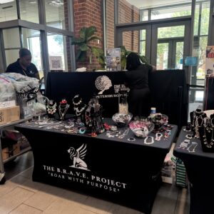 Jewelry display at a Black-owned business event.