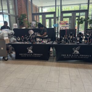 Jewelry display booth featuring various necklaces and accessories.